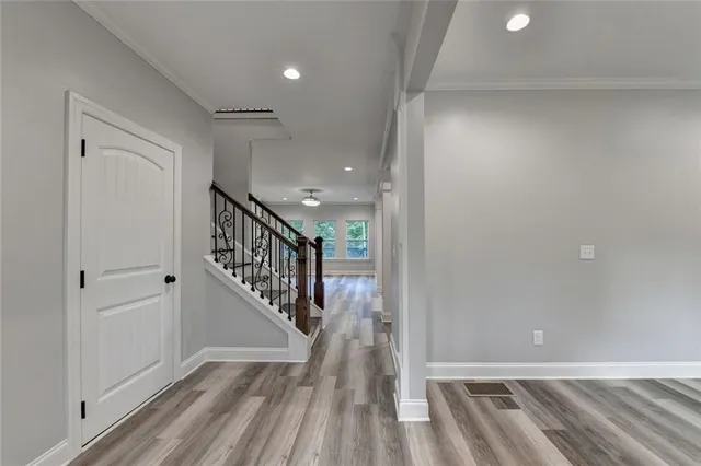 a kitchen with granite countertop a sink stainless steel appliances and cabinets