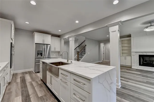 a bathroom with a sink toilet vanity and tub