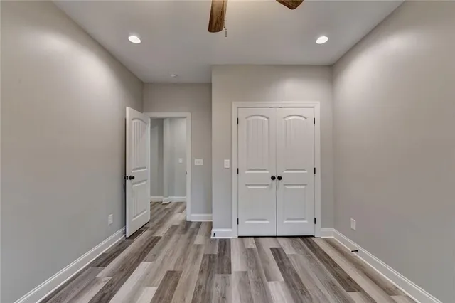 a bathroom with a double vanity sink a toilet and a mirror