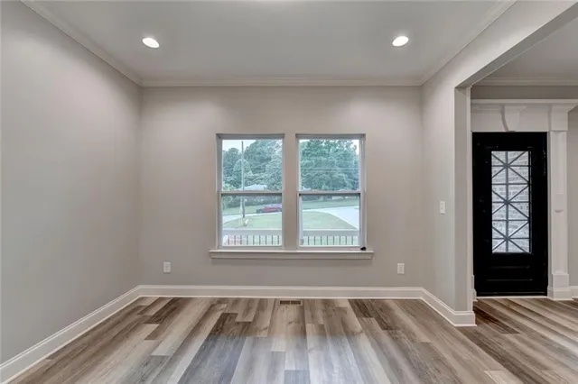 a kitchen with kitchen island sink stove and refrigerator