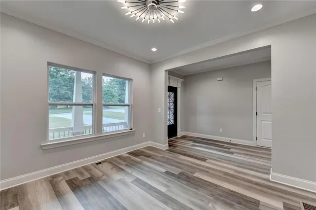 a kitchen with granite countertop a stove sink and cabinets