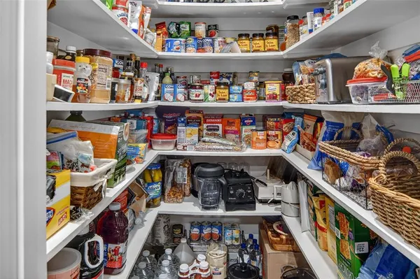 a kitchen with granite countertop a sink and a wooden floor