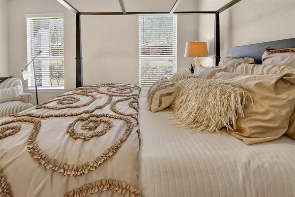 a bedroom with a bed and a couch