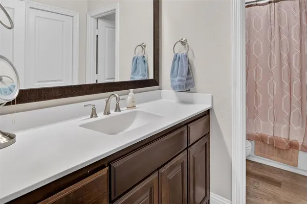 a bedroom with a bed and wall painting