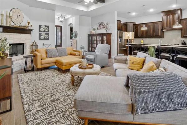 a living room with furniture and a fireplace
