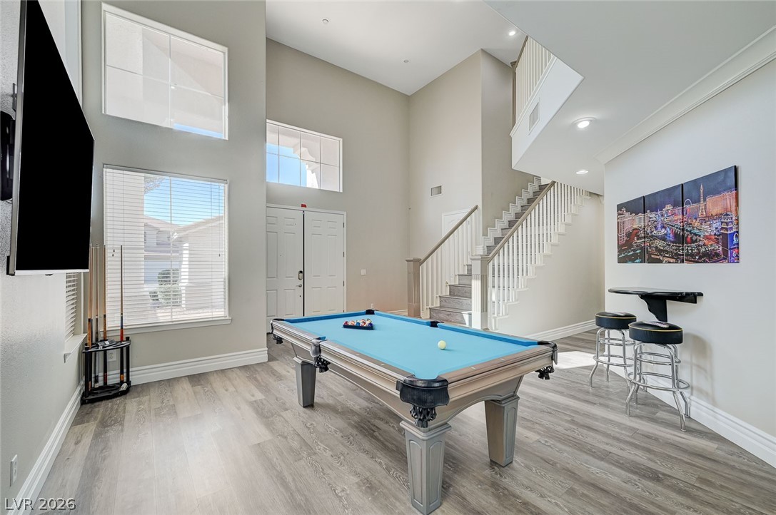 2391 Rainswept Avenue Henderson, NV 89052 - Photo 20 of 62 This inviting entertainment space offers high ceilings and elegant flooring, perfect for gatherings.