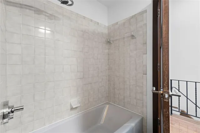 a view of an empty room and wooden floor