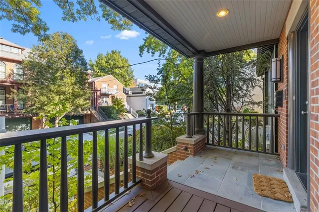 a view of balcony with wooden floor