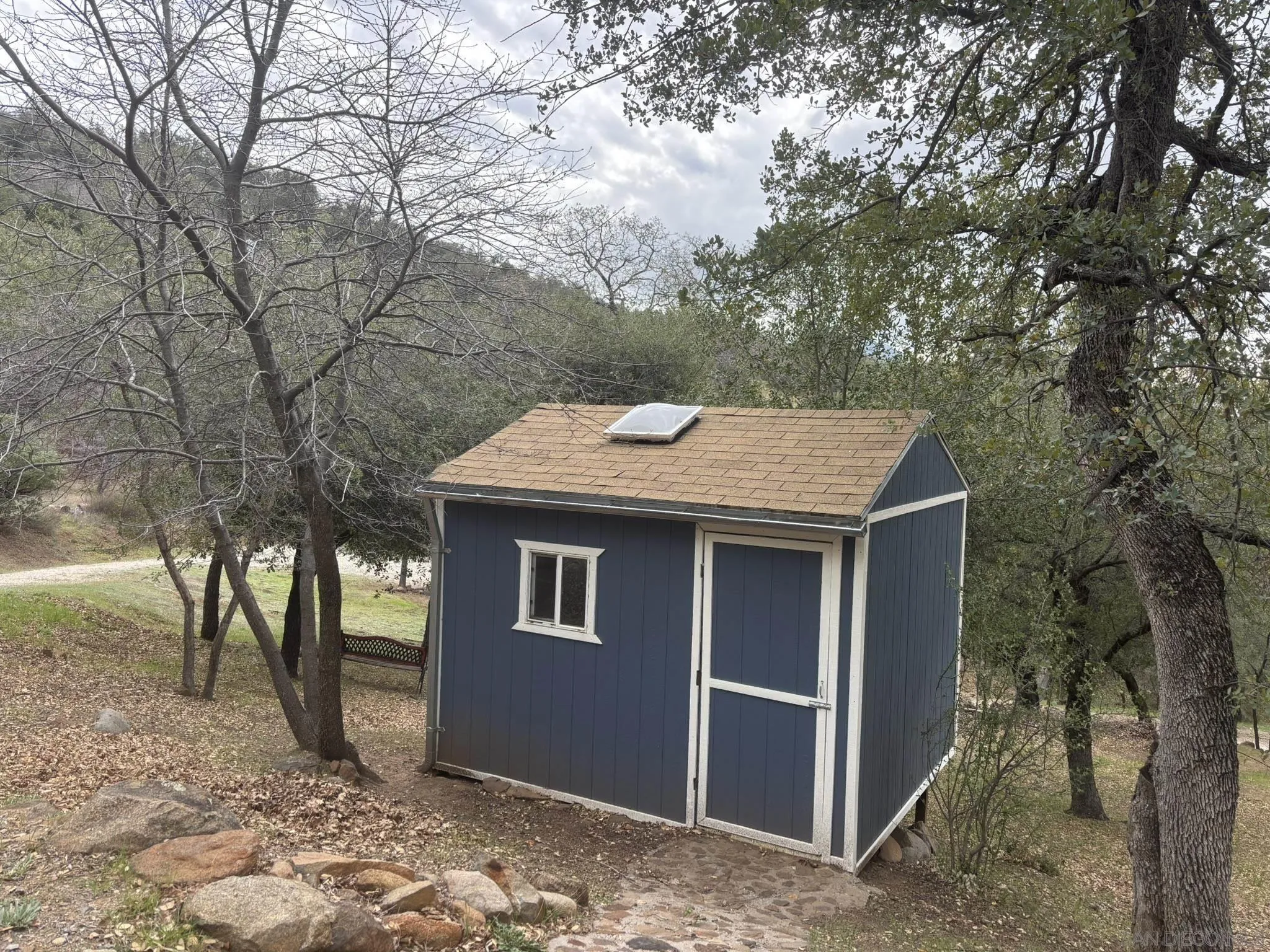 7317 Starlight Way Julian, CA 92036 - Photo 15 of 19 a front view of a house with a yard