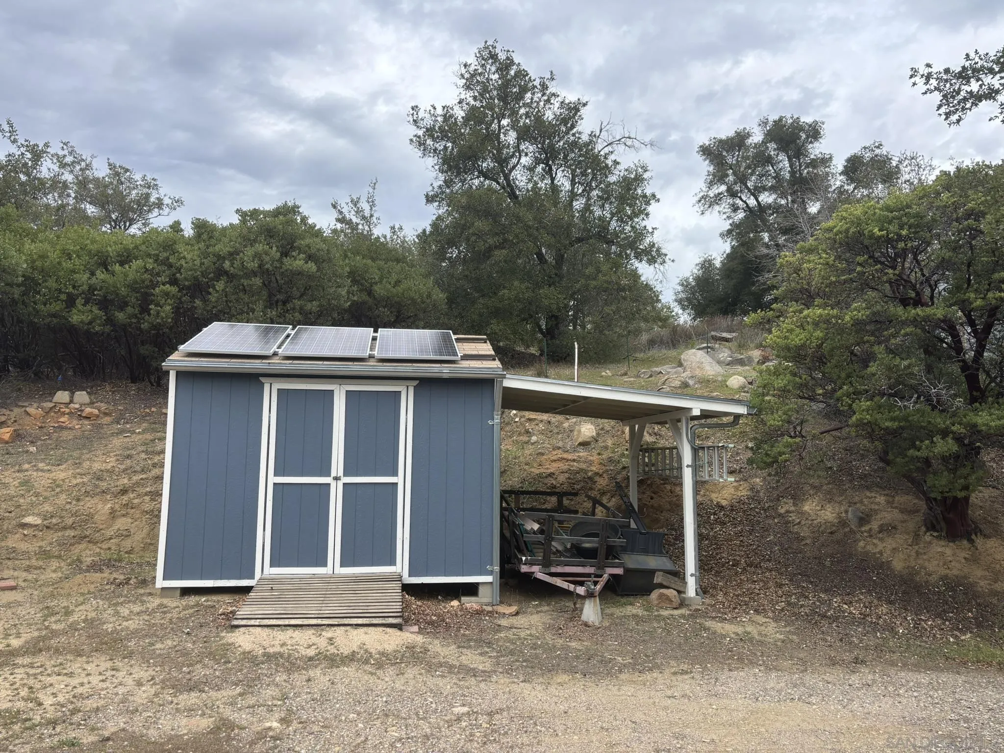 7317 Starlight Way Julian, CA 92036 - Photo 2 of 19 a view of a house with a yard and wooden fence