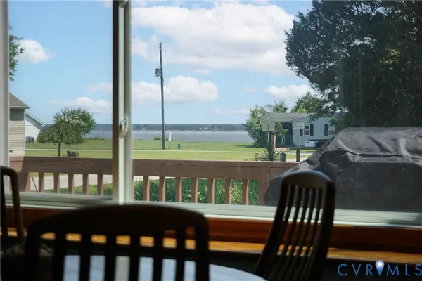 a view of a balcony with a table and chairs