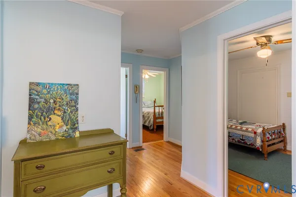 a view of bedroom with furniture and wooden floor