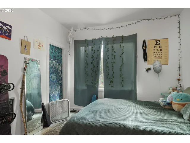 a view of a house with a yard and potted plants