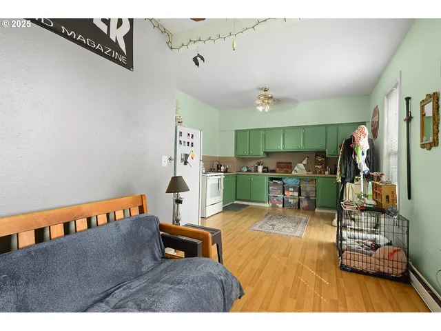 a bedroom with a bed and a television