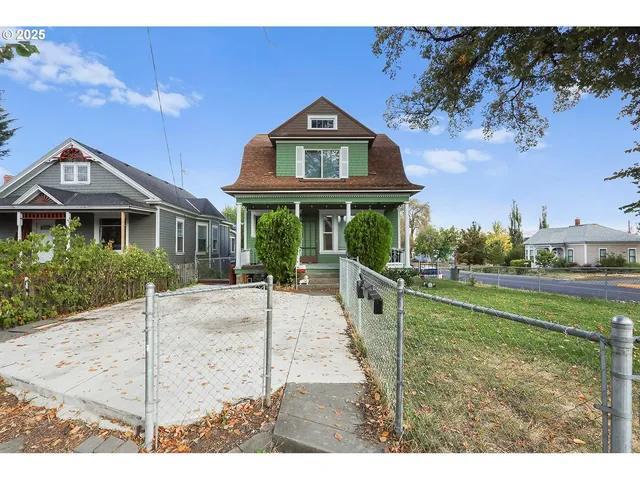 a building exterior with the table and chairs