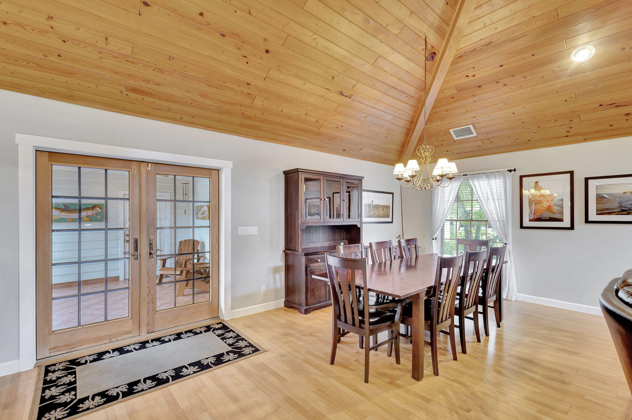 18199 April Lane Jupiter, FL 33458 - Photo 11 of 70 a view of a dining room with furniture window and wooden floor