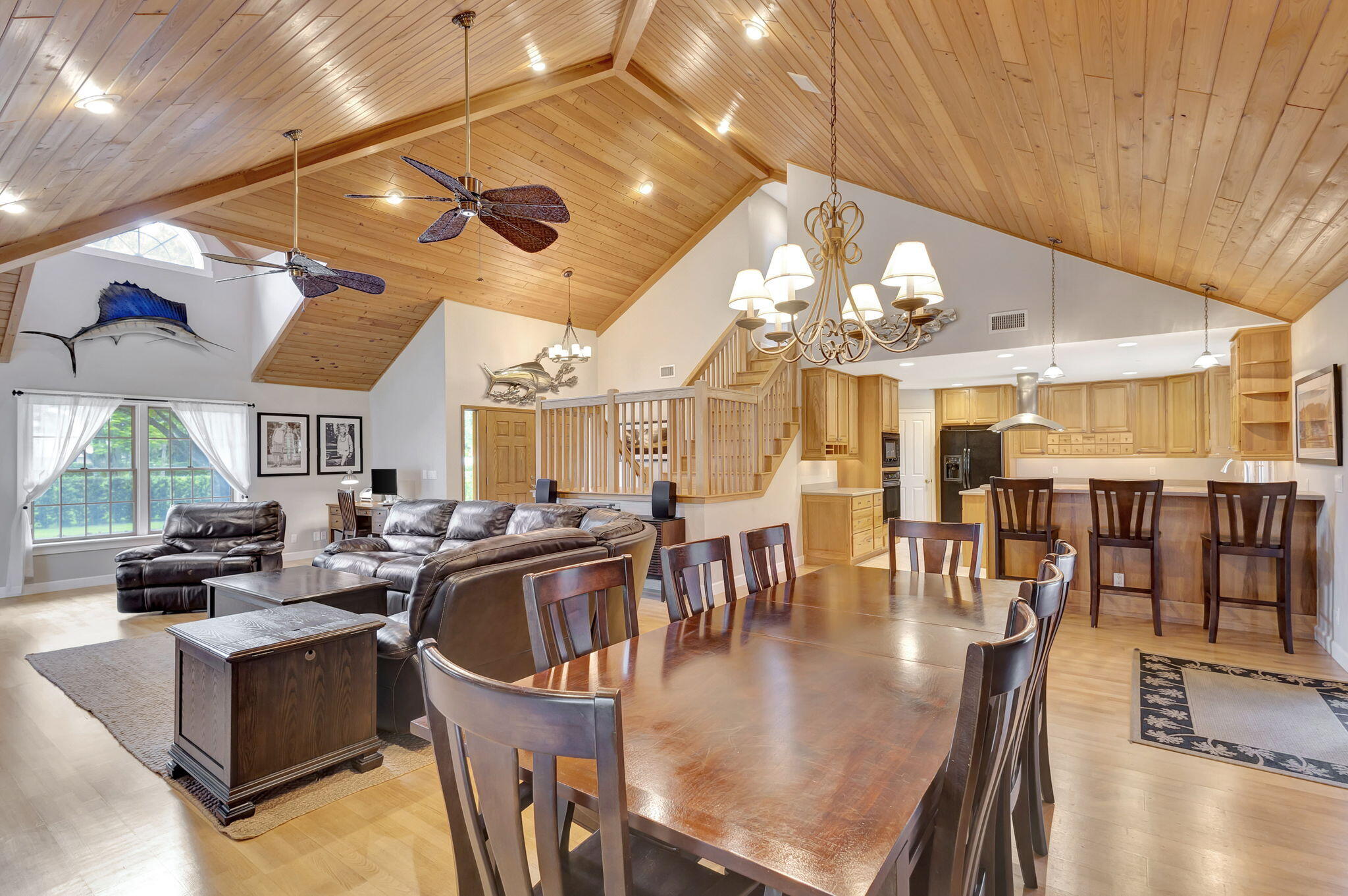18199 April Lane Jupiter, FL 33458 - Photo 12 of 70 a kitchen with a table chairs and a chandelier
