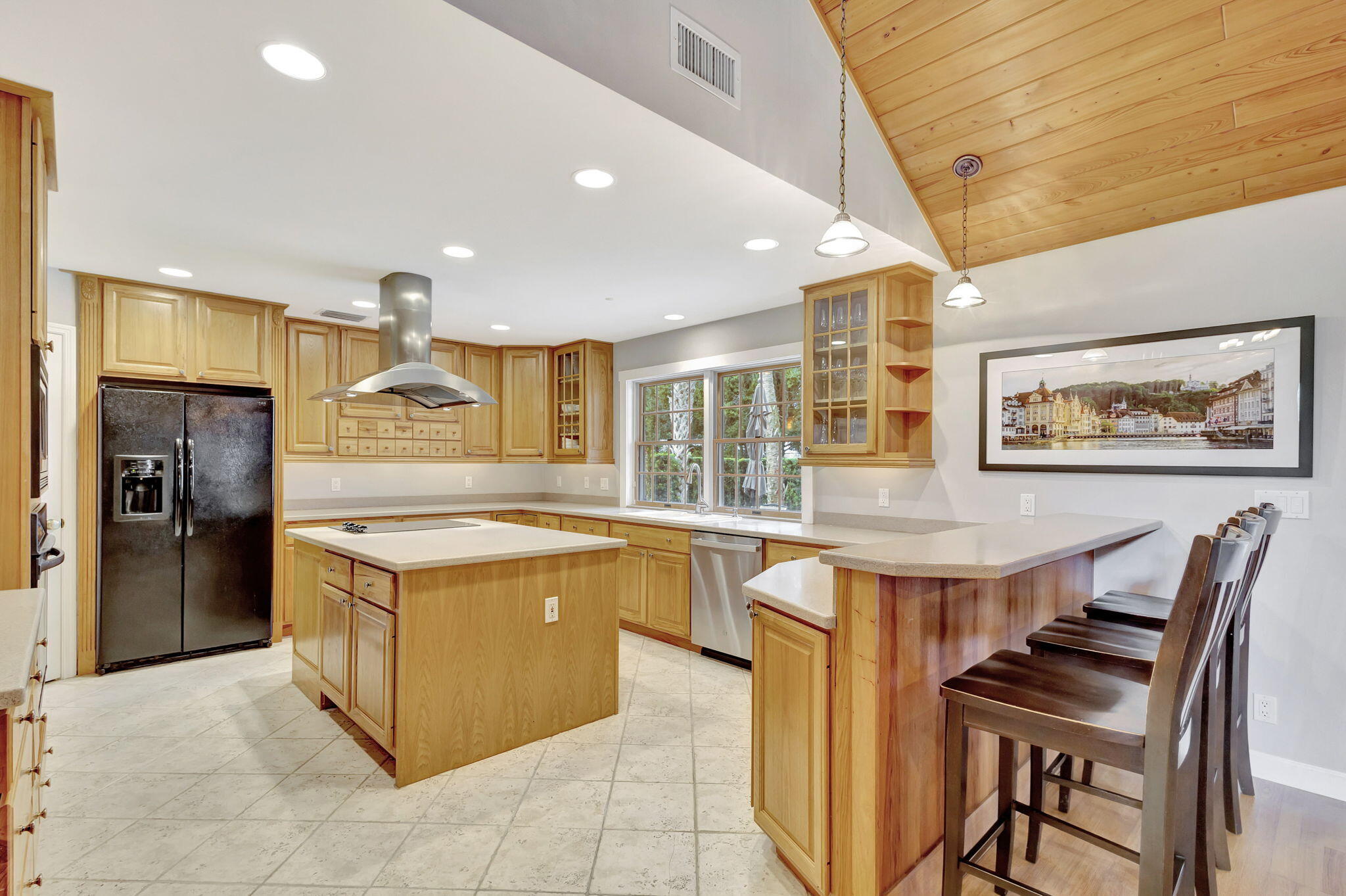 18199 April Lane Jupiter, FL 33458 - Photo 16 of 70 a kitchen with stainless steel appliances granite countertop a stove and a refrigerator