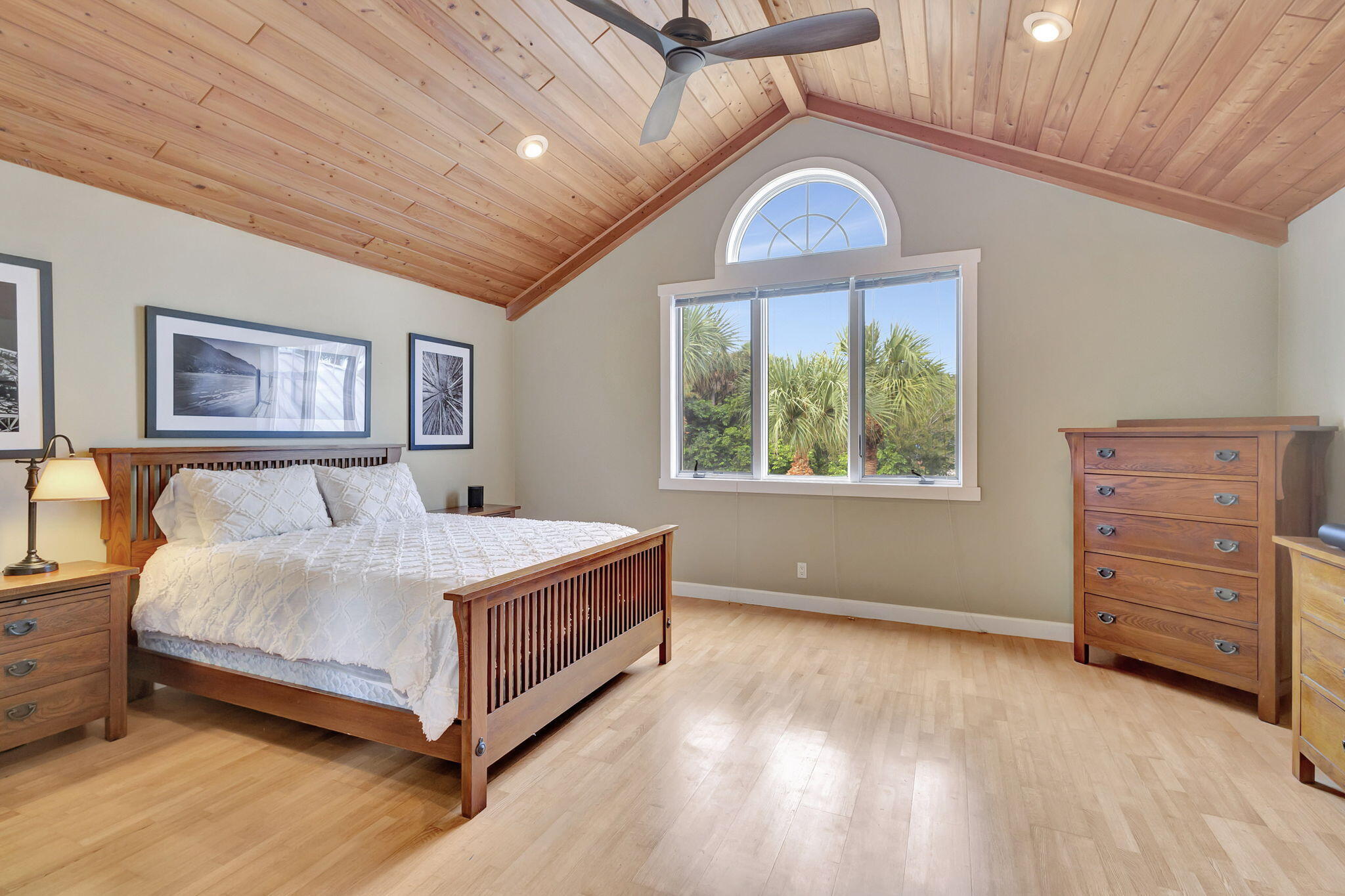 18199 April Lane Jupiter, FL 33458 - Photo 26 of 70 a spacious bedroom with a bed and a dresser