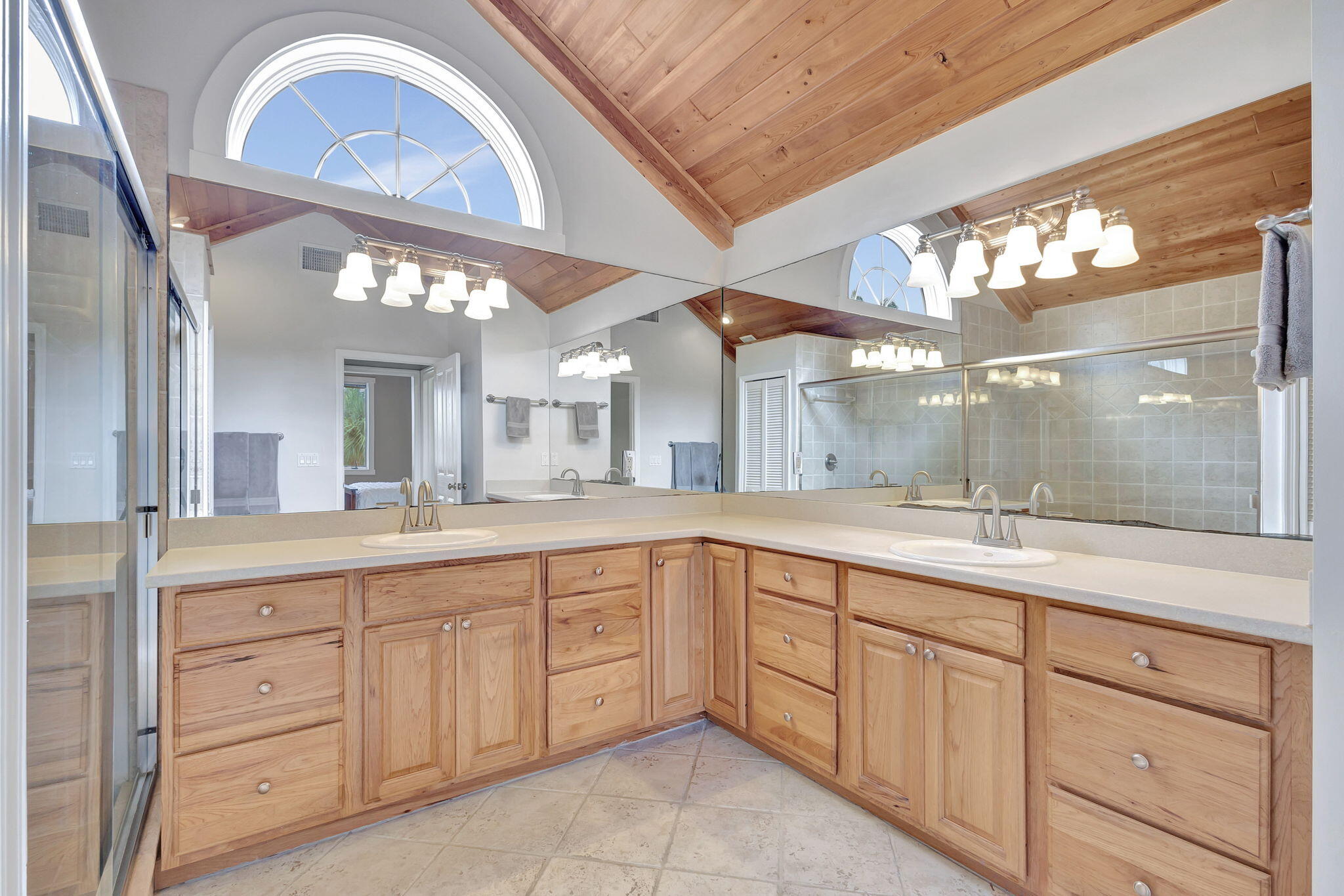 18199 April Lane Jupiter, FL 33458 - Photo 30 of 70 a large bathroom with a double vanity sink and a mirror