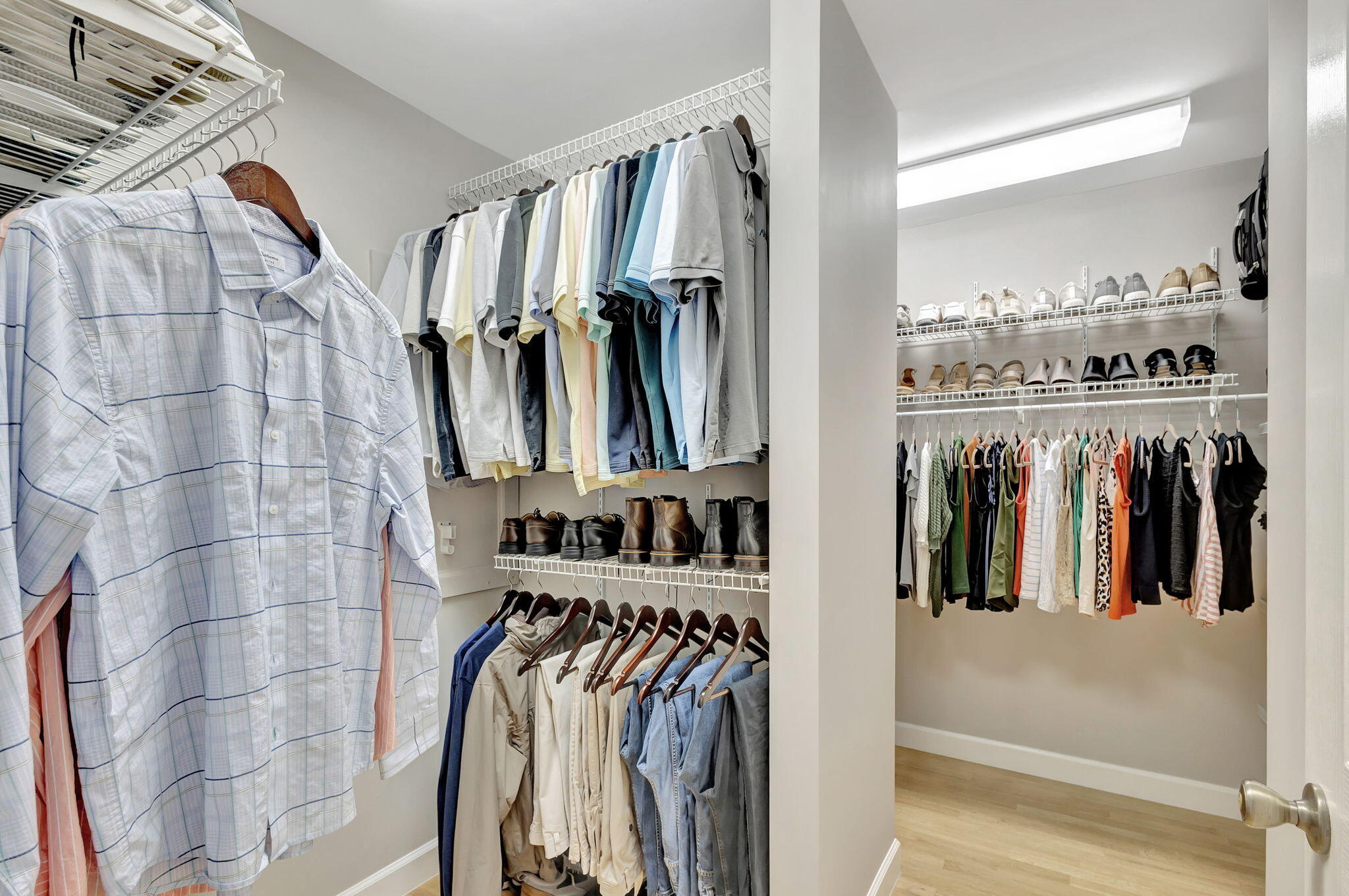 18199 April Lane Jupiter, FL 33458 - Photo 33 of 70 a view of walk in closet with clothes and shoes