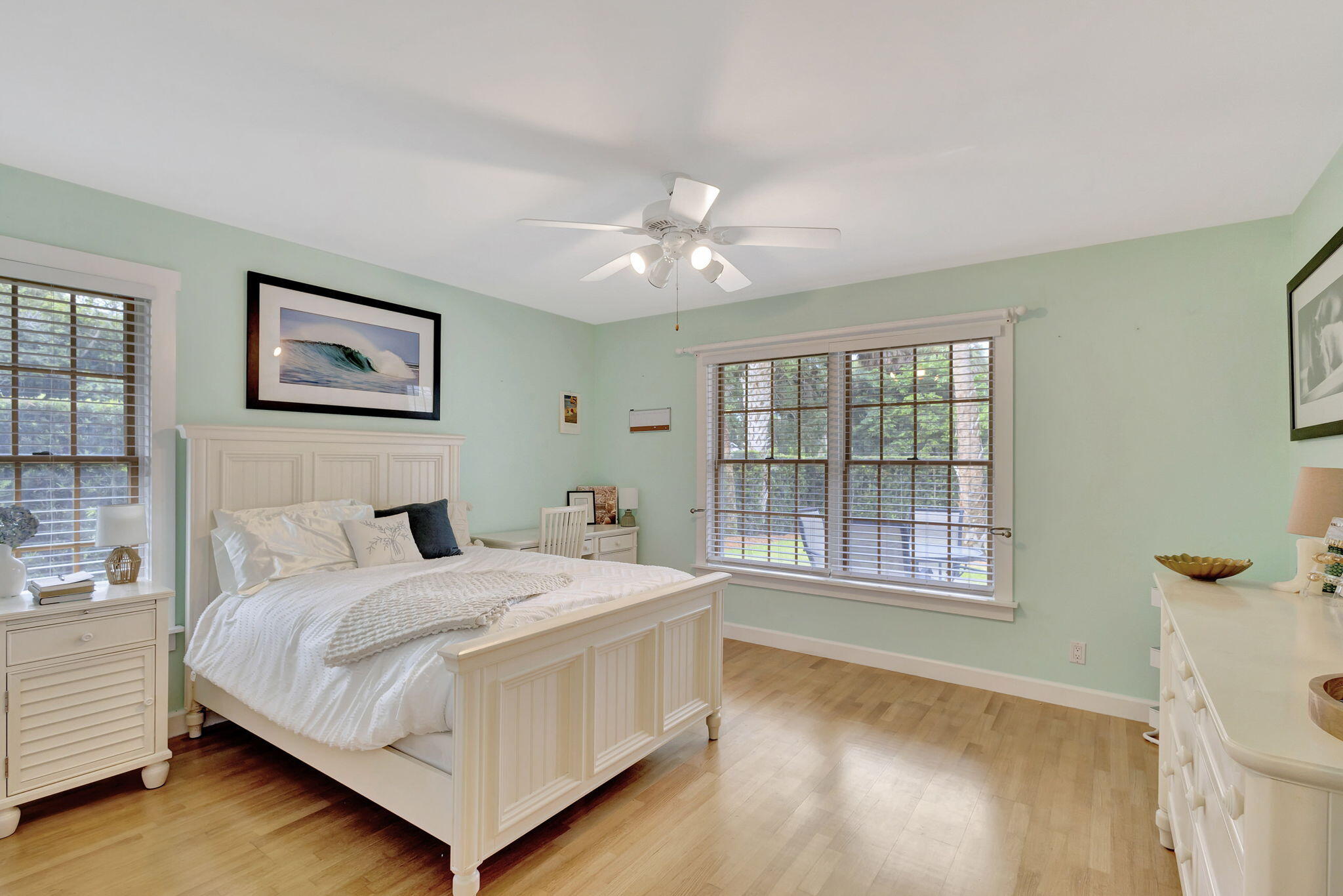 18199 April Lane Jupiter, FL 33458 - Photo 38 of 70 a bedroom with a bed and a large window with outer view