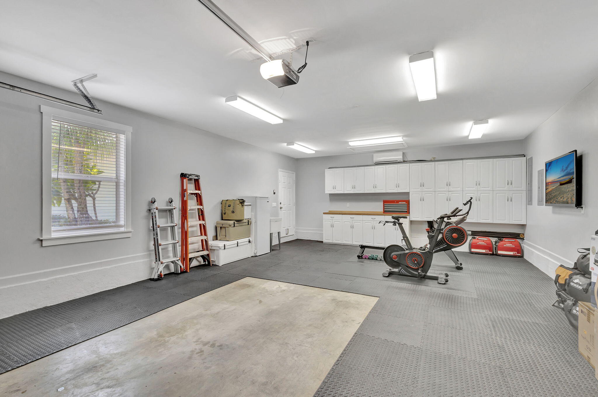 18199 April Lane Jupiter, FL 33458 - Photo 50 of 70 a living room with furniture and a window