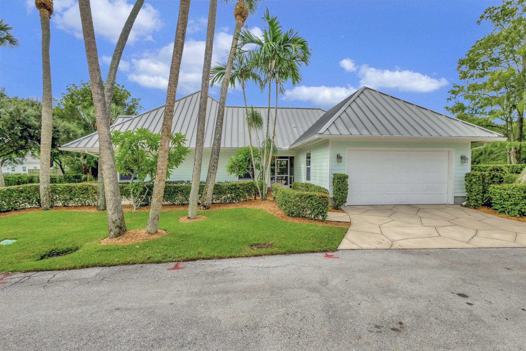 18199 April Lane Jupiter, FL 33458 - Photo 51 of 70 a front view of house with yard and green space