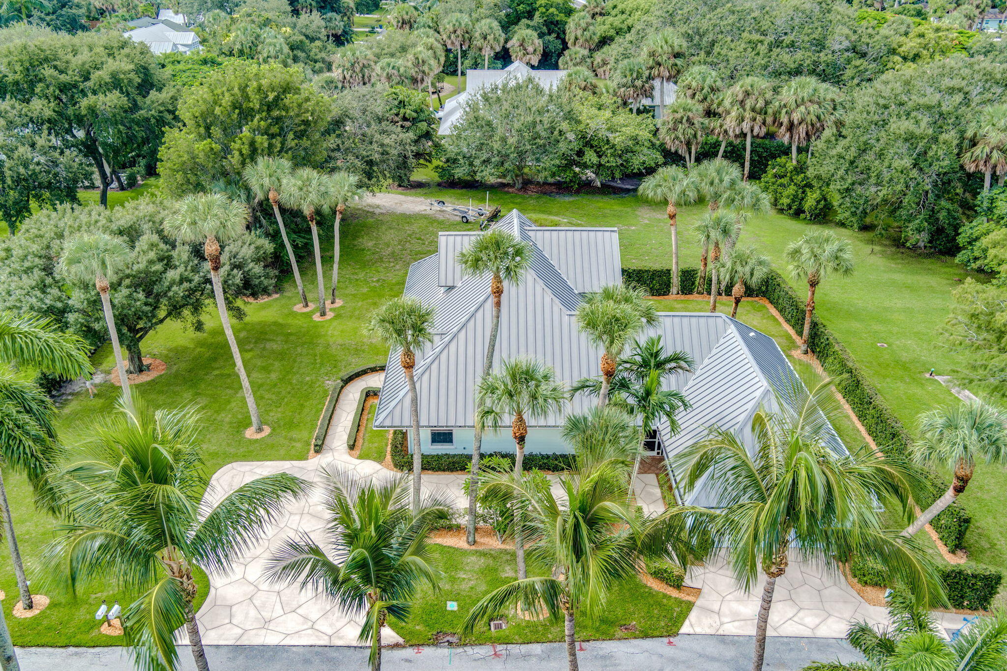 18199 April Lane Jupiter, FL 33458 - Photo 55 of 70 a view of a lake with a palm tree