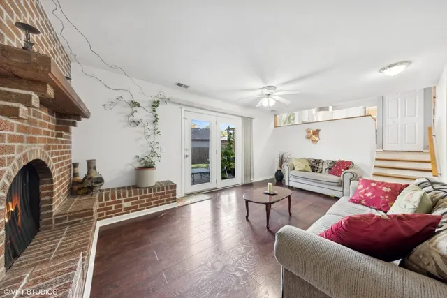 a living room with furniture or couch and a fireplace