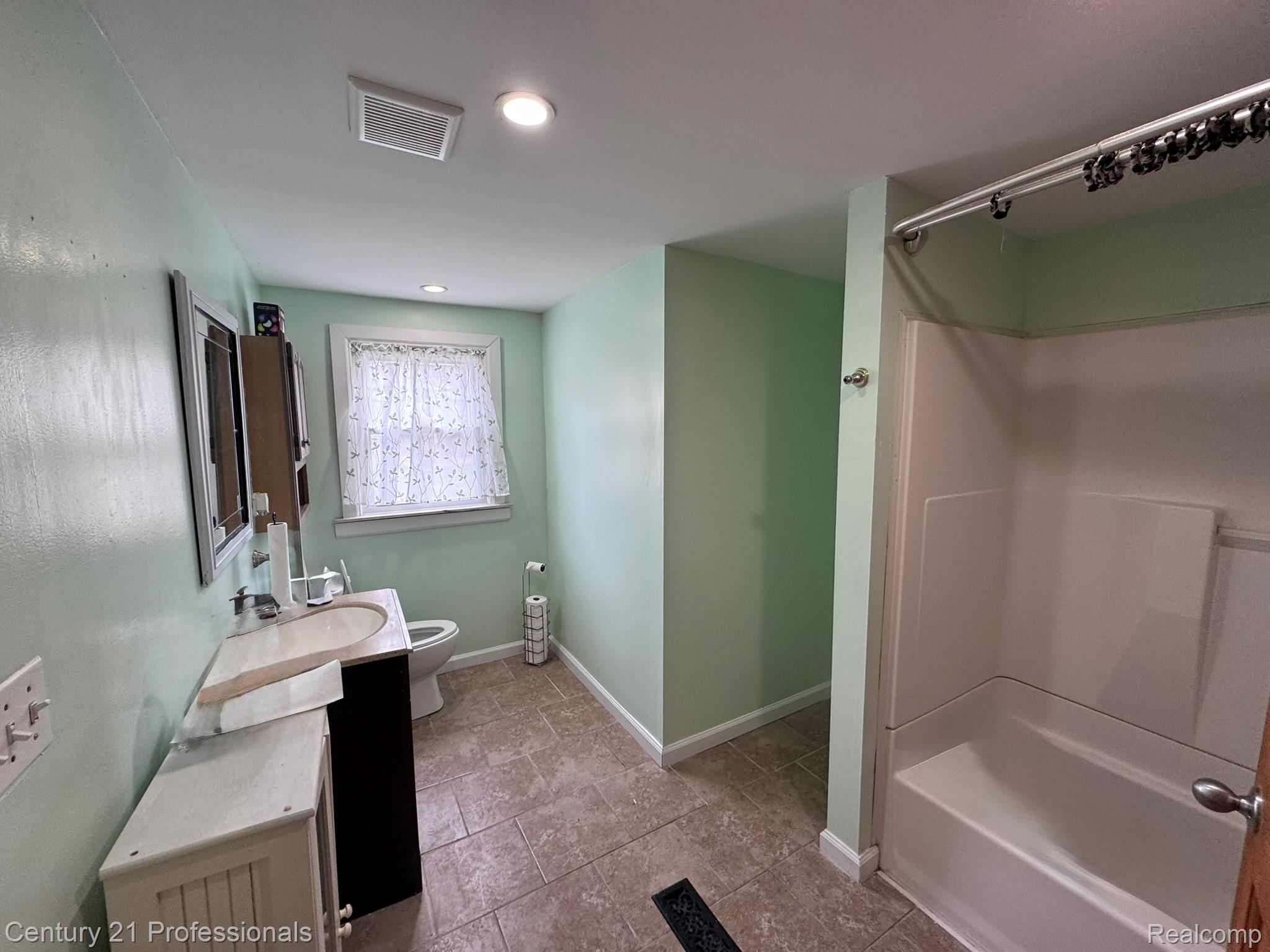2021 West Rose Center Road Holly, MI 48442 - Photo 21 of 30 Full bath with vanity, tub / shower combination, and recessed lighting