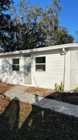 a backyard of a house with lots of green space