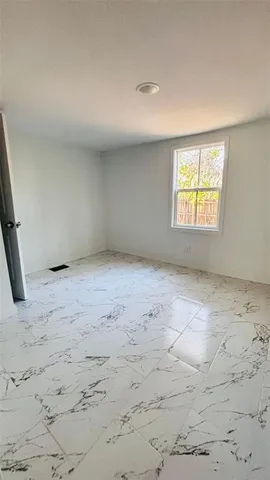 en empty room with windows