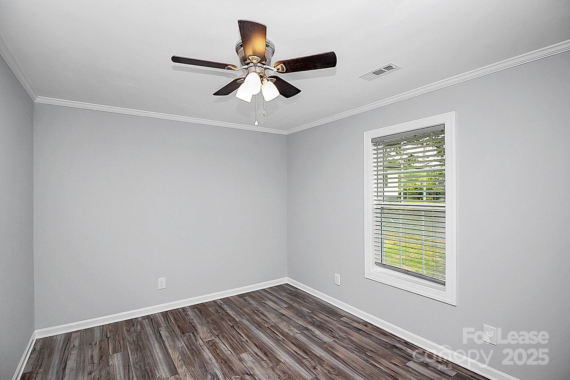 1027 Little Avenue, Unit D Gastonia, NC 28052 - Photo 12 of 20 a view of room with window and ceiling fan