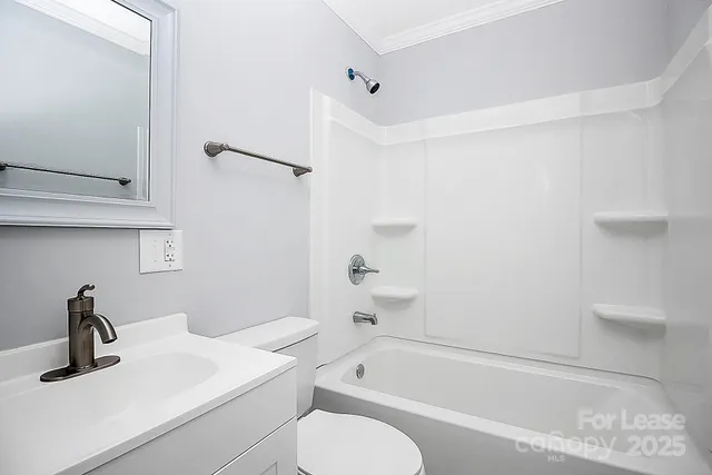 a bathroom with a sink a toilet and a bathtub