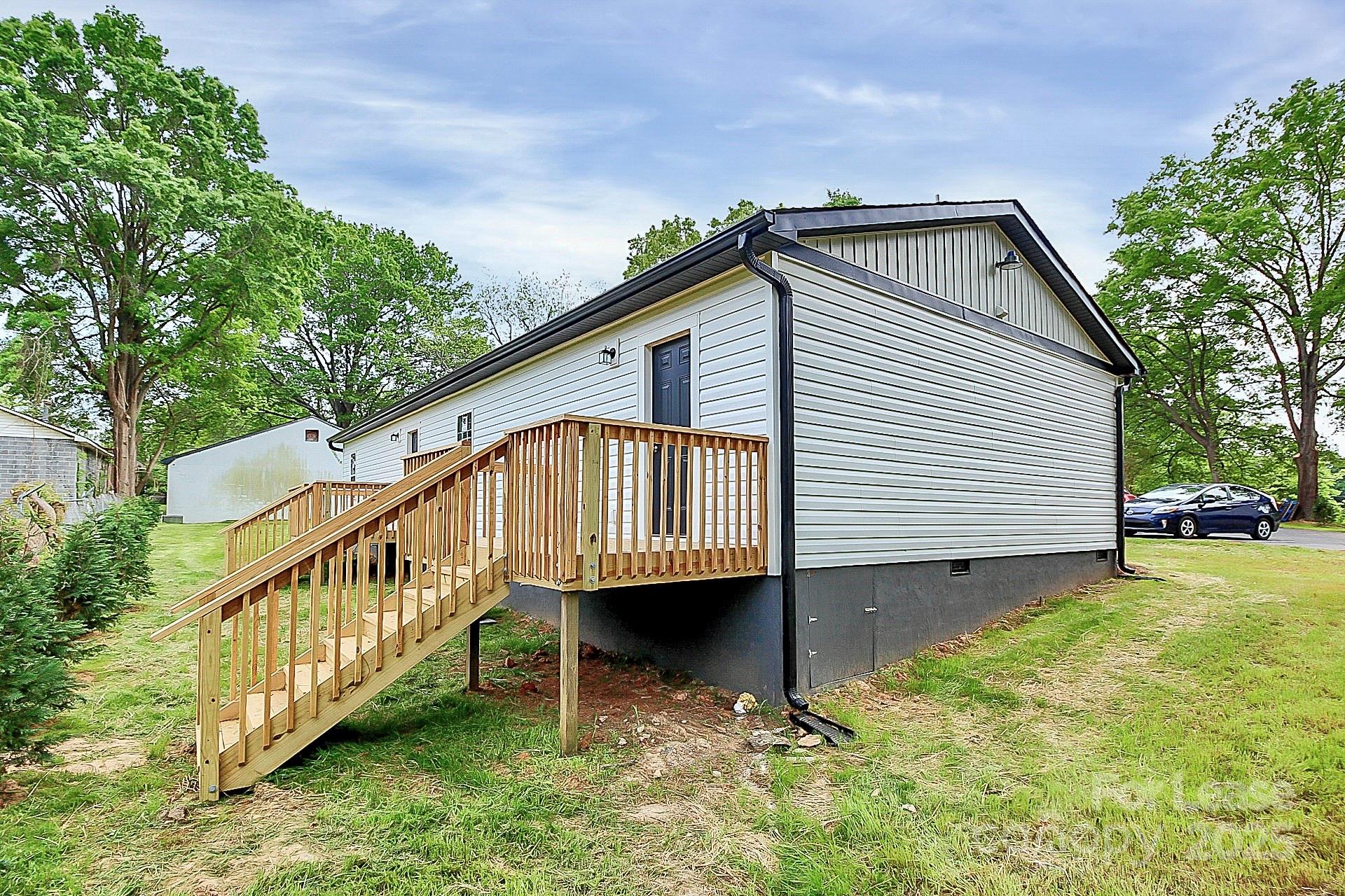 1027 Little Avenue, Unit D Gastonia, NC 28052 - Photo 19 of 20 a view of a house with a yard