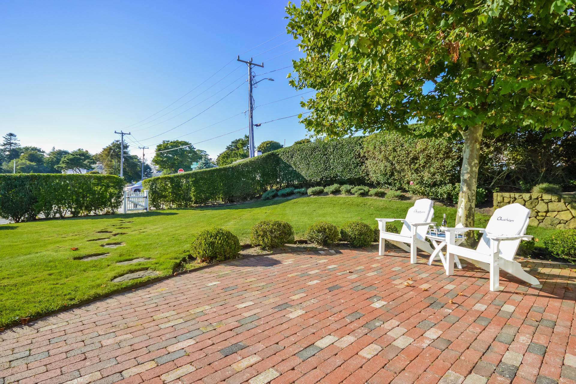 58 Pond Street Chatham, MA 02633 - Photo 12 of 38 a view of a lake with a table and chairs
