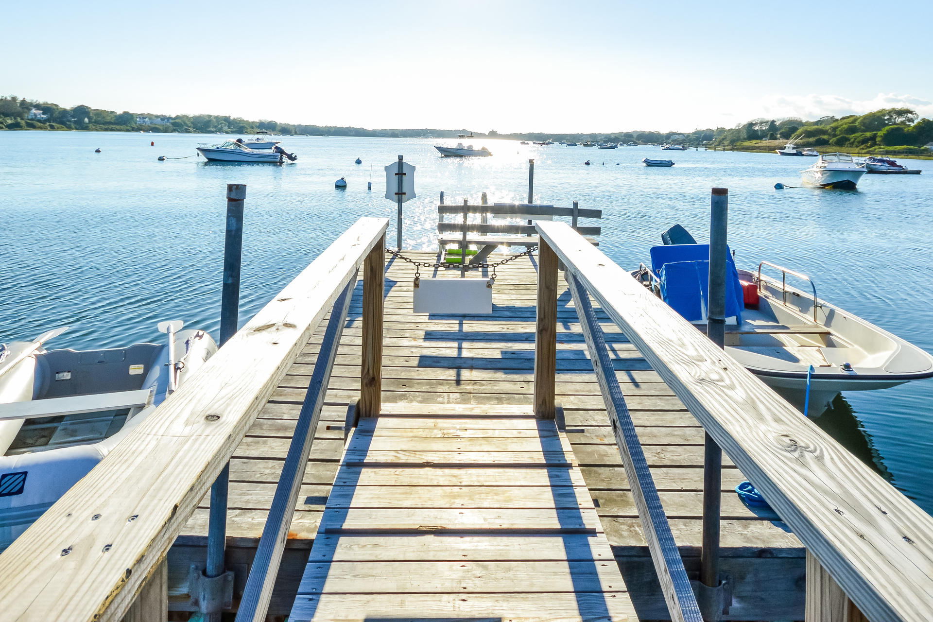 58 Pond Street Chatham, MA 02633 - Photo 15 of 38 a view of a balcony with wooden chairs and two chairs