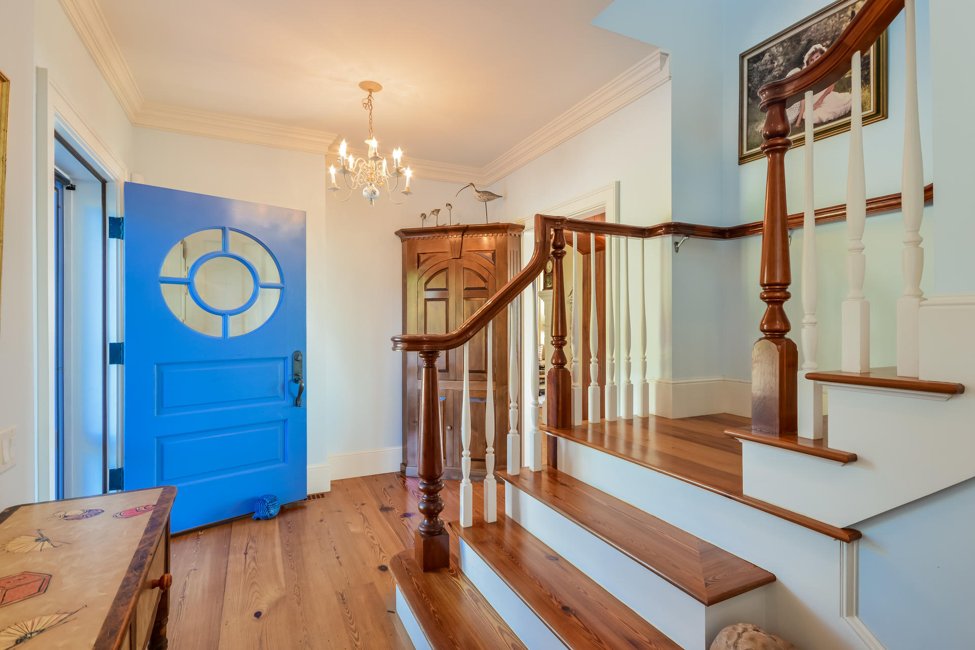 58 Pond Street Chatham, MA 02633 - Photo 17 of 38 a bedroom with a bed and a chandelier