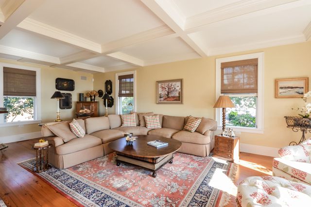 a living room with furniture and a rug