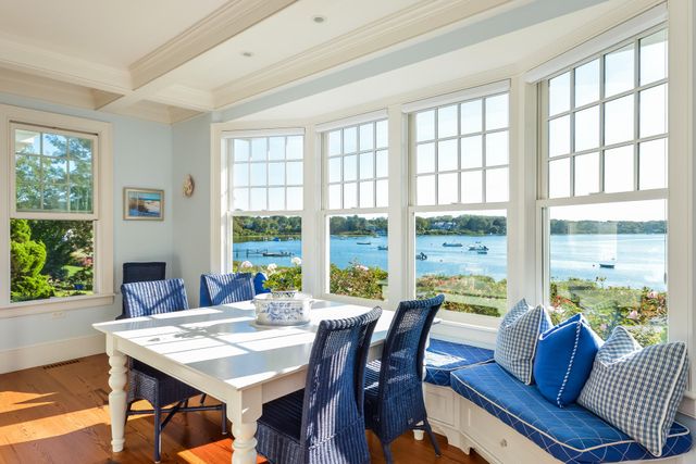 a view of a dining room with furniture window and outside view