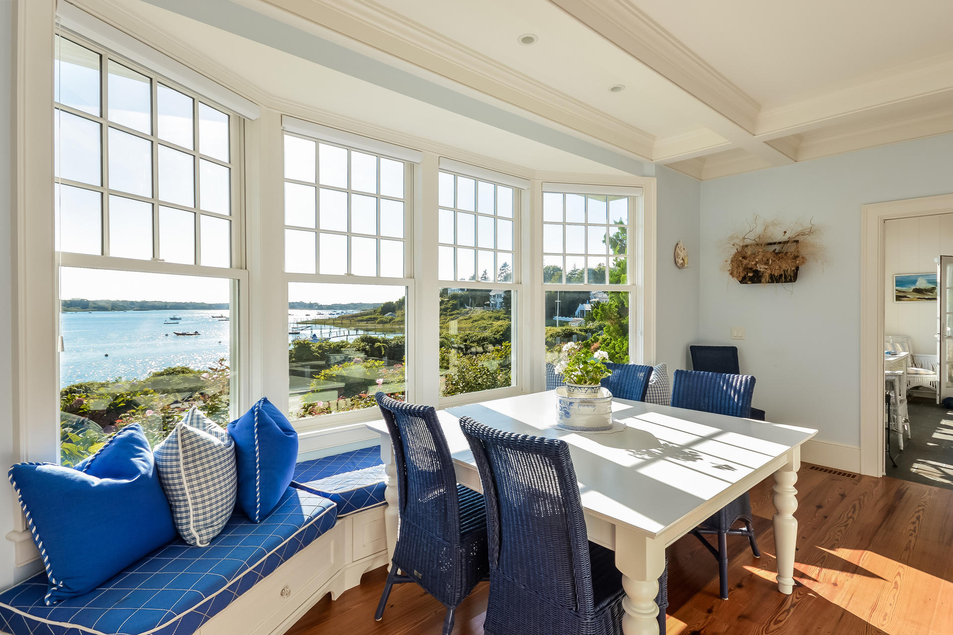 58 Pond Street Chatham, MA 02633 - Photo 22 of 38 a view of a dining room with furniture large windows and wooden floor