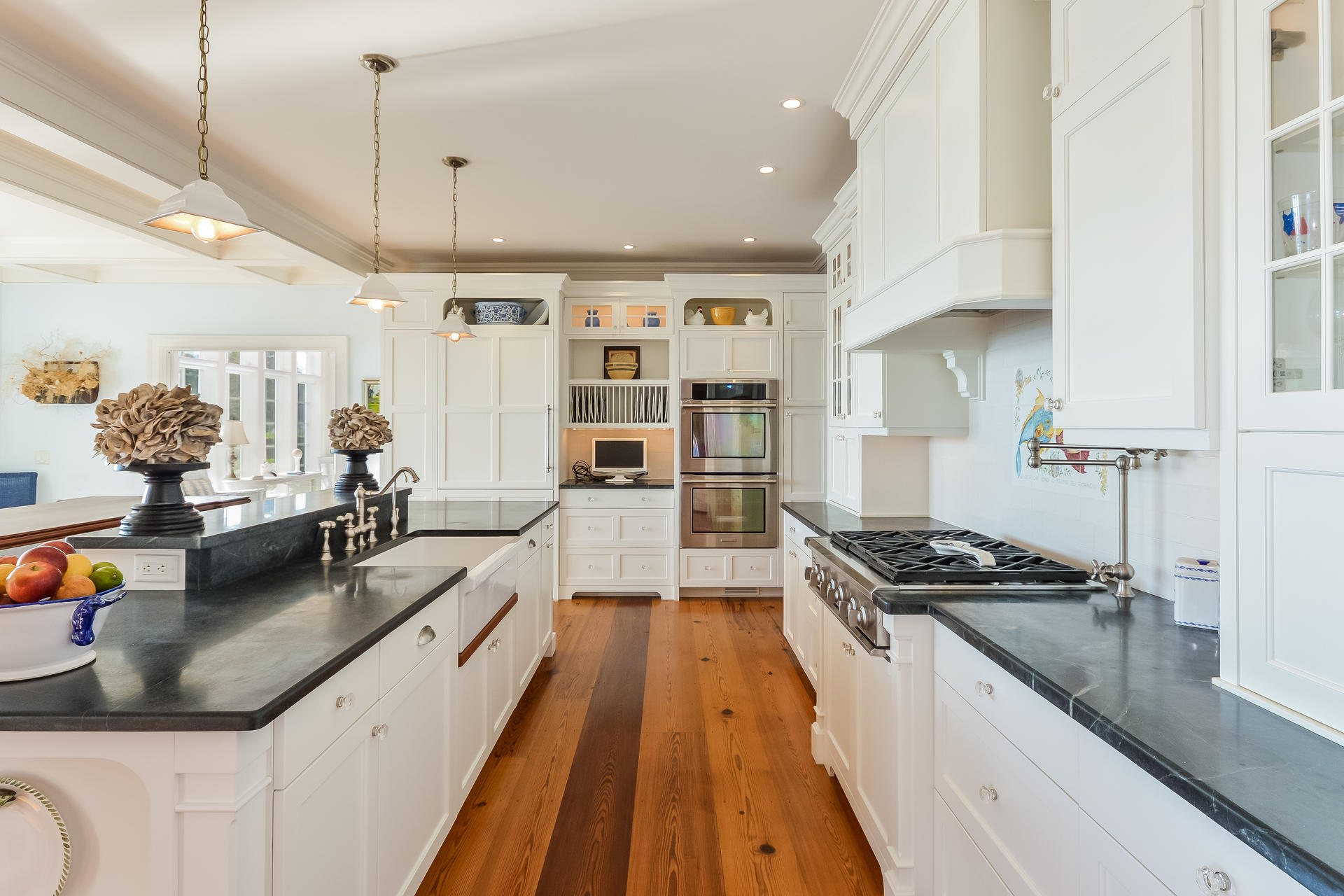 58 Pond Street Chatham, MA 02633 - Photo 25 of 38 a kitchen with stainless steel appliances kitchen island granite countertop a stove a sink and a refrigerator