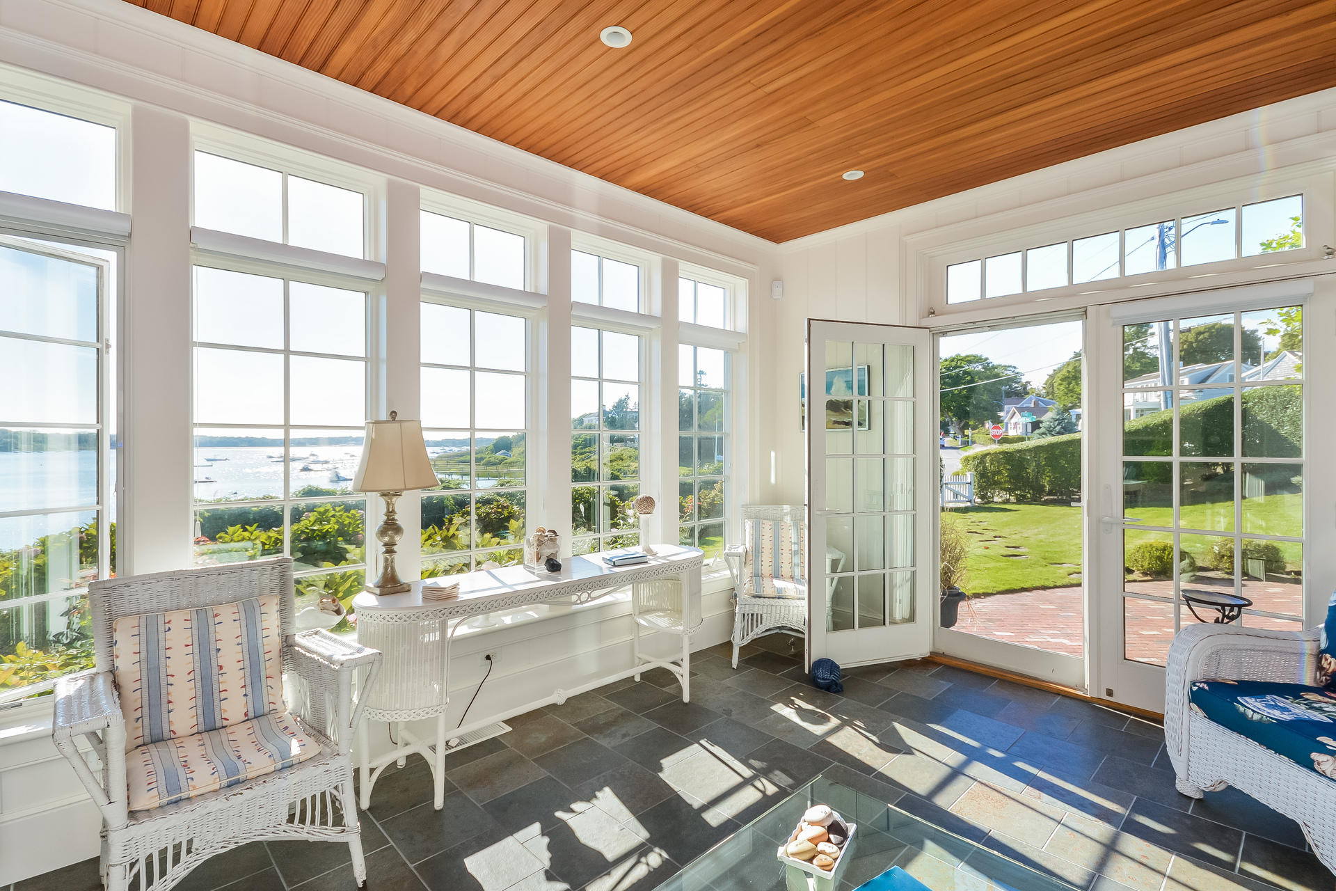 58 Pond Street Chatham, MA 02633 - Photo 27 of 38 a living room with a large window and floor to ceiling windows