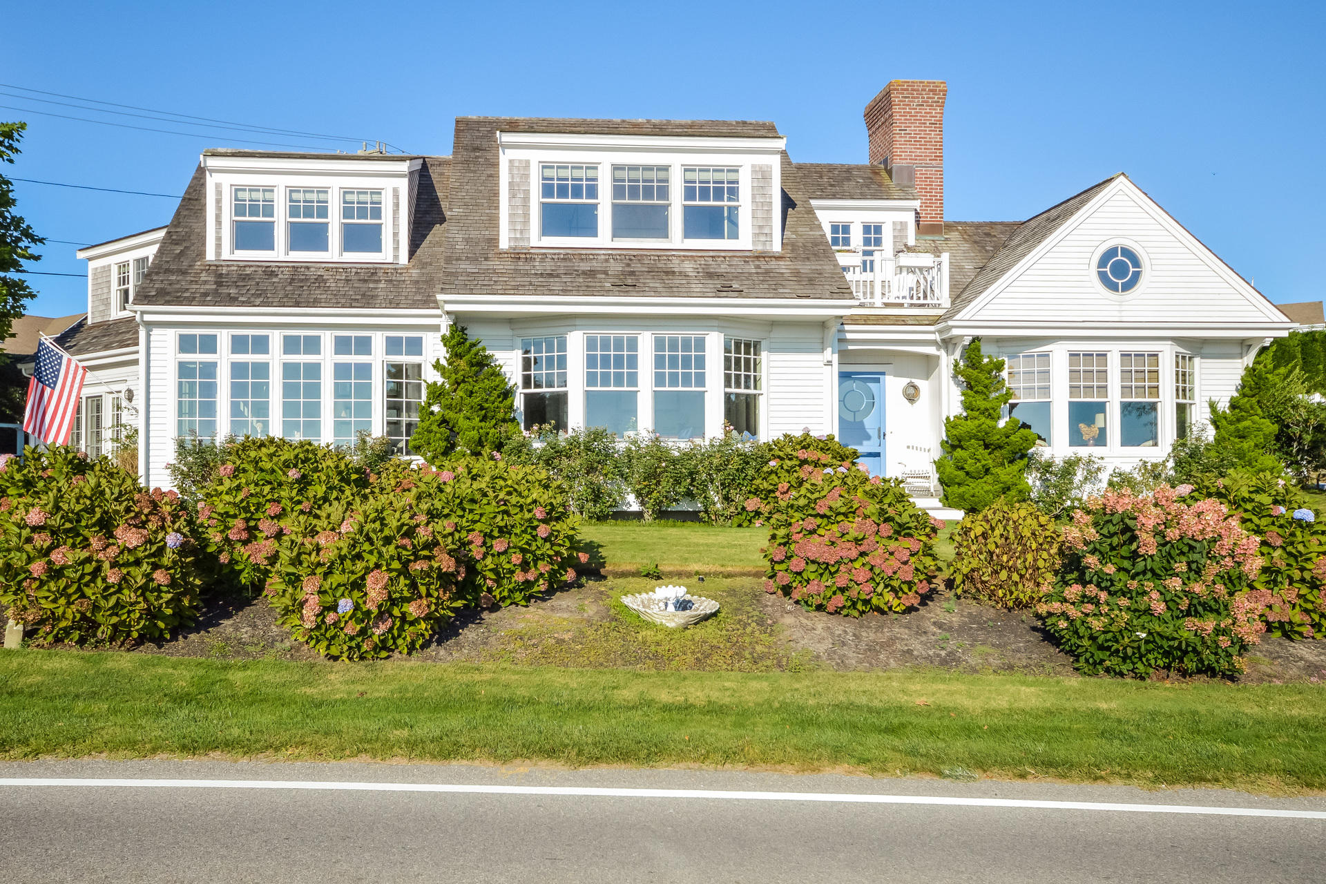 58 Pond Street Chatham, MA 02633 - Photo 4 of 38 a front view of a house with a yard