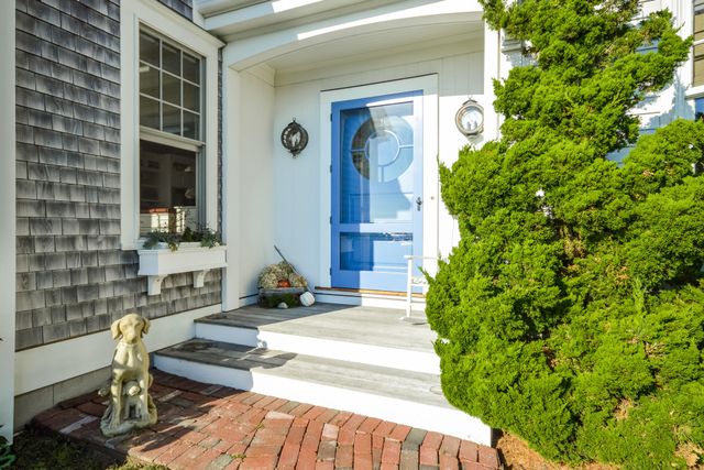a front view of a house with garden