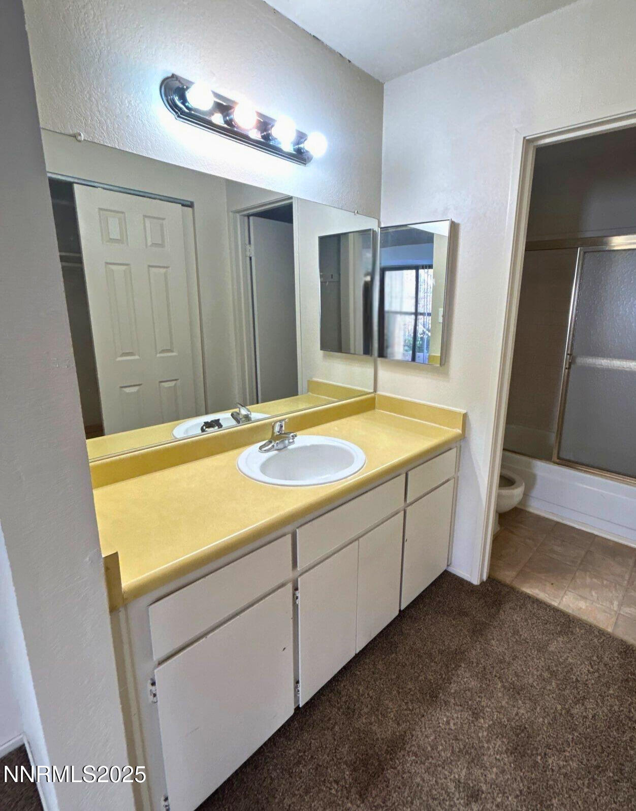 2450 Lymbery Street, Unit 311 Reno, NV 89509 - Photo 8 of 13 a bathroom with a sink and a shower