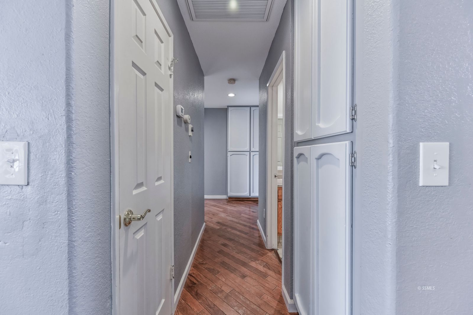 633 East Church Avenue Ridgecrest, CA 93555 - Photo 16 of 27 a view of a hallway with wooden floor