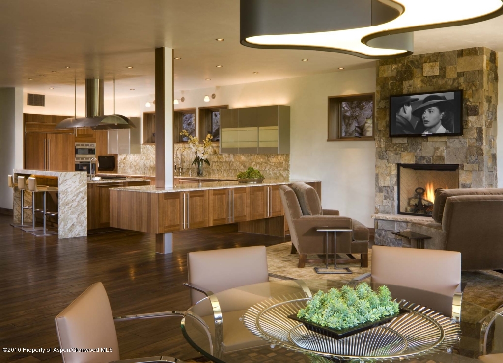 151 Nighthawk Drive Aspen, CO 81612 - Photo 3 of 14 a living room with fireplace furniture and a view of kitchen