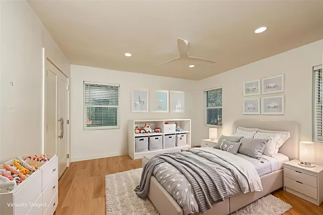 a bedroom with a large bed and a window